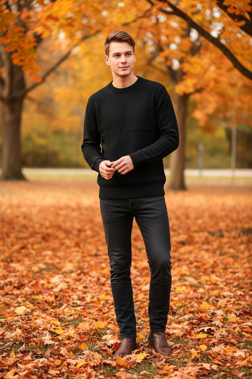 Black turtleneck sweater with a 'warm' label on a hanger