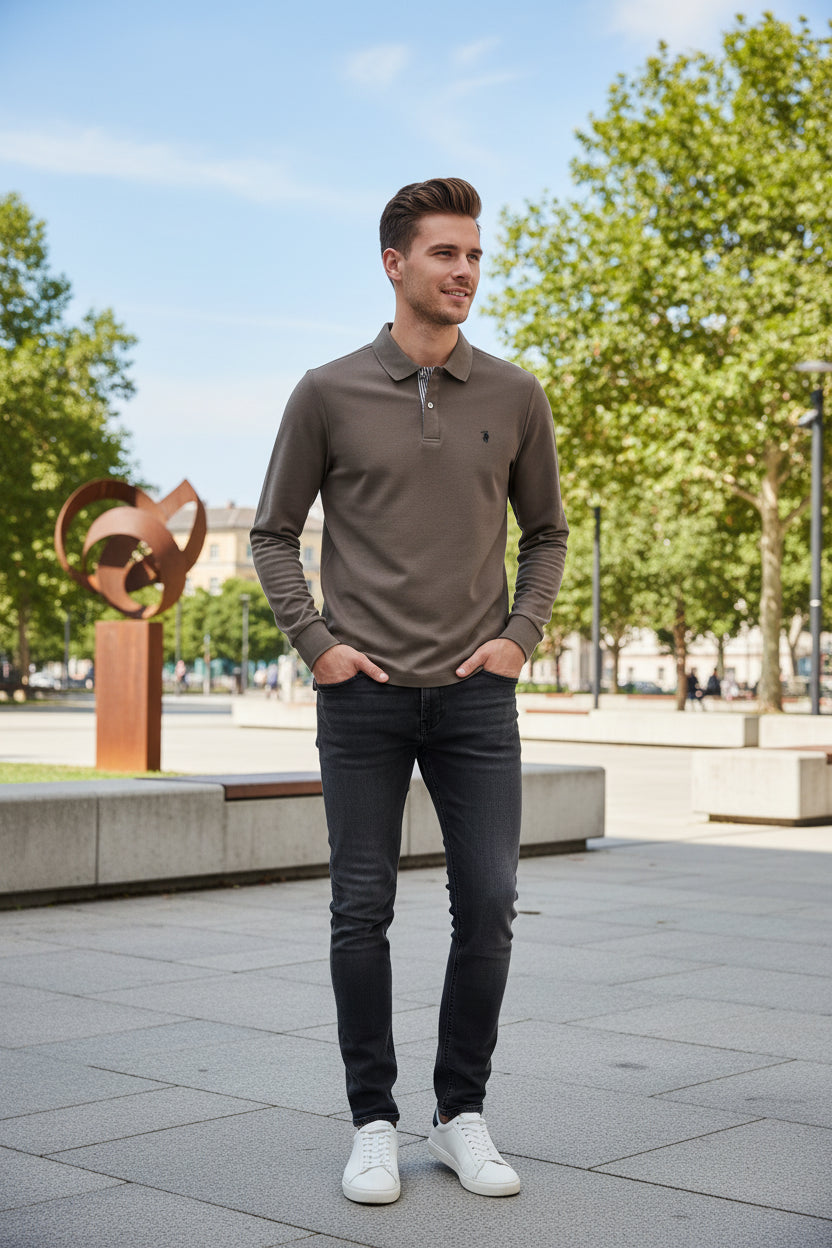 Brown long-sleeve polo shirt on a hanger with other colored shirts in the background