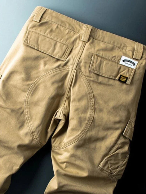 Khaki cargo pants shown flat from the back.