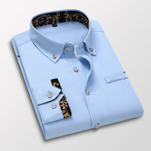 Light blue dress shirt with patterned inner lining on a light gray background
