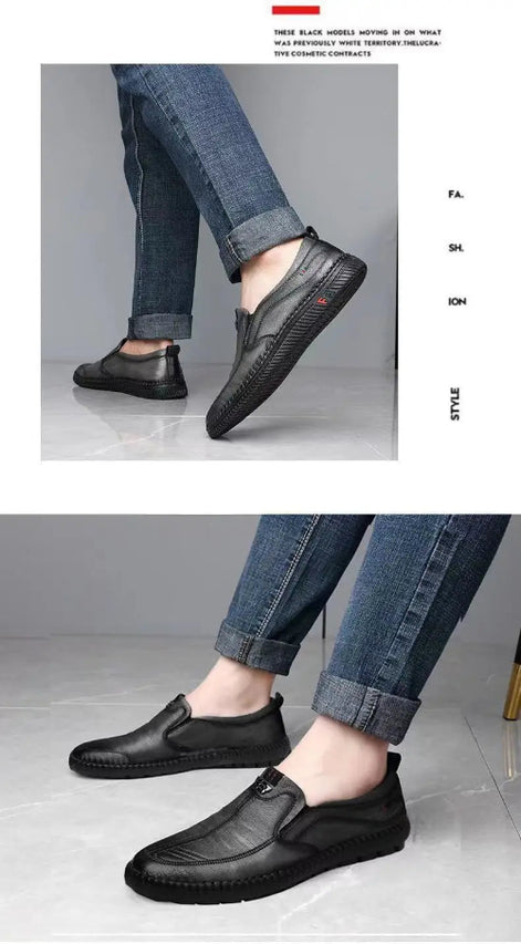 Black loafers worn with jeans on a gray background