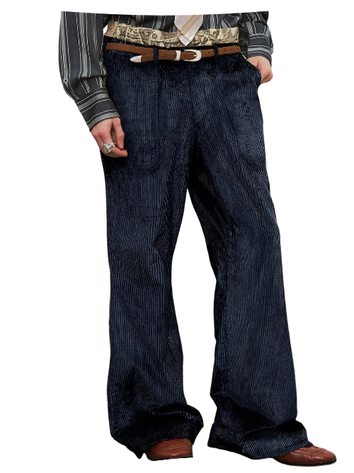 A person wearing dark blue pinstriped trousers with a brown belt, a patterned shirt, and brown shoes, shown from the waist down on a white background.