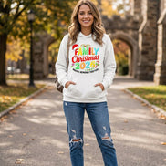 A white pullover hoodie laid flat with a colorful Christmas-themed graphic reading 'FAMILY Christmas 2026' and 'MAKING MEMORIES TOGETHER,' plus a Santa hat and candy cane motifs. 