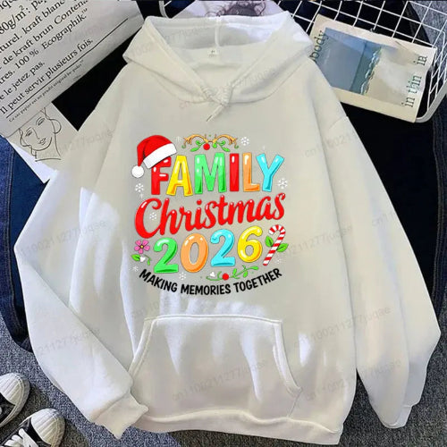 A white pullover hoodie laid flat with a colorful Christmas-themed graphic reading 'FAMILY Christmas 2026' and 'MAKING MEMORIES TOGETHER,' plus a Santa hat and candy cane motifs. 