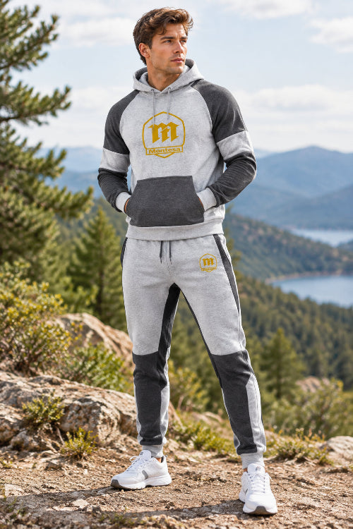 A two-piece athletic loungewear set featuring a raglan hoodie and matching jogger pants in heather gray