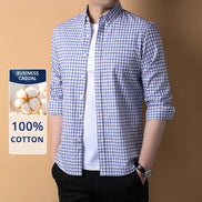 Man wearing a blue and white checkered shirt with a label indicating 100% cotton and business casual wear.