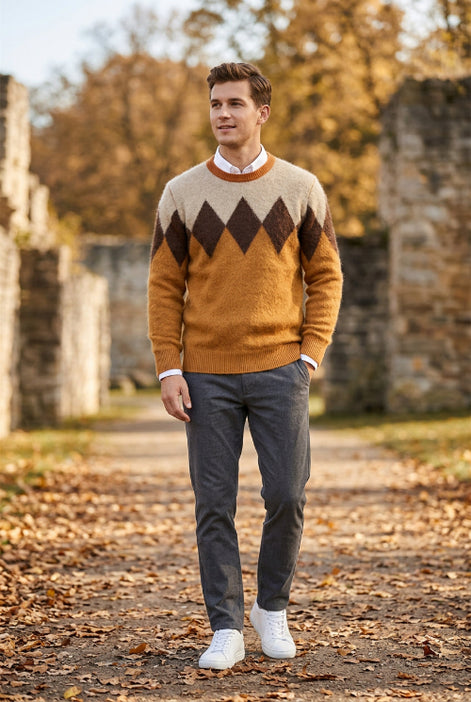 A men's long-sleeve knit sweater with a classic argyle pattern in shades of brown, beige, and camel orange, 