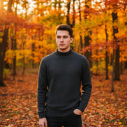 Dark gray turtleneck sweater with a hand touching the fabric, featuring a 'warm' icon.