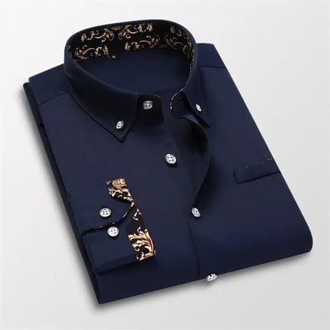 Folded navy blue shirt with gold accents on a light gray background