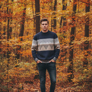 Blue and gray striped sweater on a white background