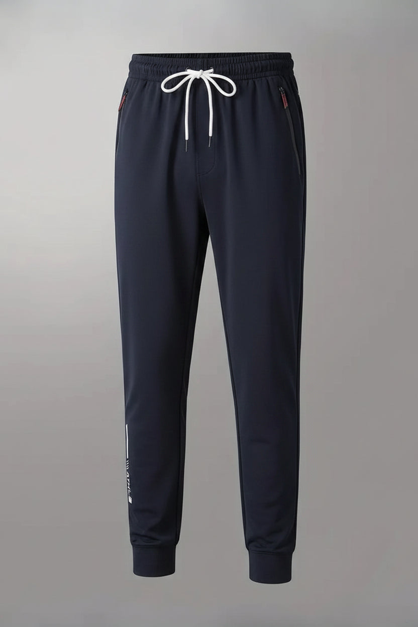 Dark blue pants with a small white logo on a gray background