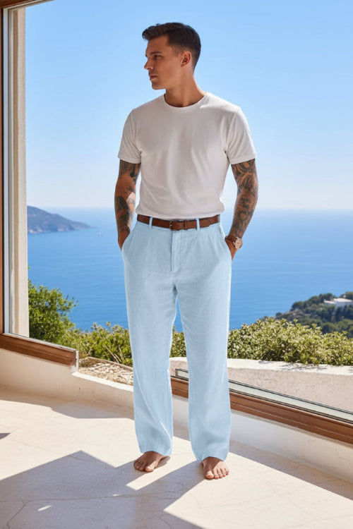 Person wearing light blue pants with a blurred scenic background