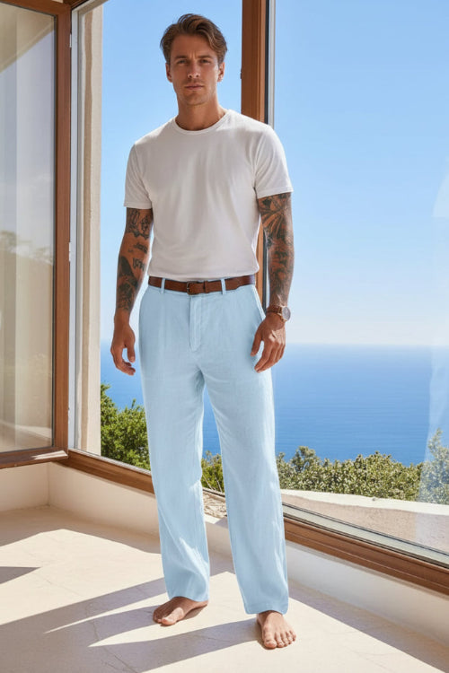 Person wearing light blue pants with a blurred scenic background