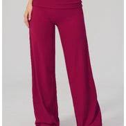 Maroon wide-leg pants worn by a person on a white background