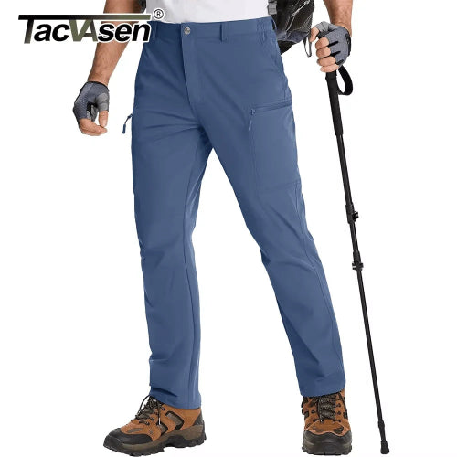 Person wearing blue hiking pants with hiking gear on a white background