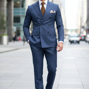 Blue suit with a brown tie and pocket square, featuring 'Customize Mens Tuxe Store' text.