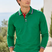 A long-sleeve green polo shirt with a classic collar, featuring a red inner placket and white, red, and blue striped trim on the collar and cuffs, 