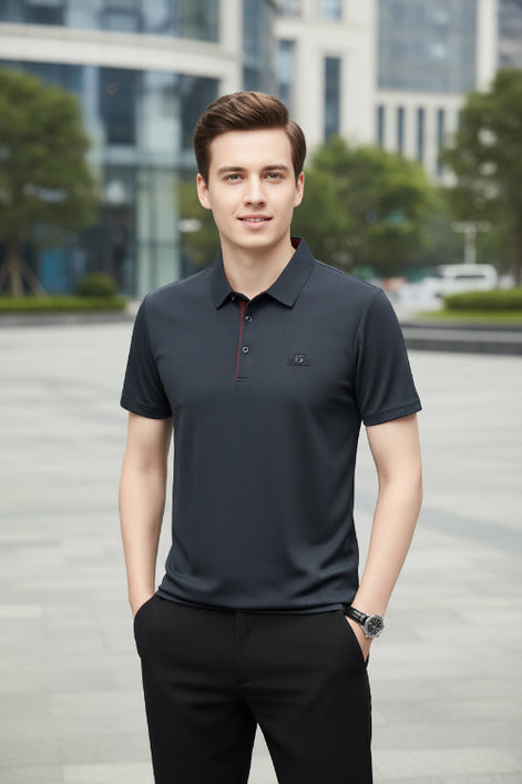 Dark gray polo shirt with a small logo on a gray background