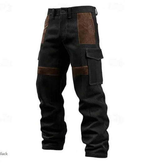 Black corduroy cargo pants with brown contrast panels, belt loops, and flap thigh pockets against a white background.⠋