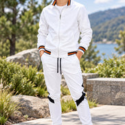 White tracksuit with black and orange accents on a white background
