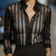 Black sheer striped shirt worn by a model, shown from the front.