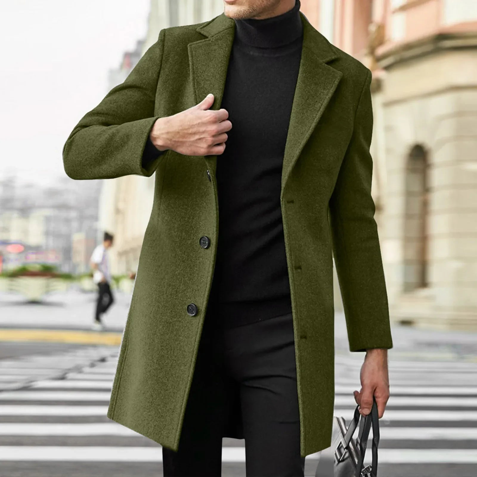 Person wearing a green coat in an urban setting