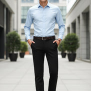 Man wearing black pants with a gray background