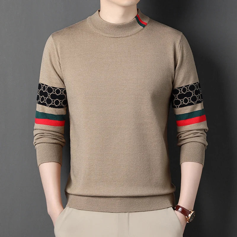 Beige sweater with patterned sleeves on a dark background