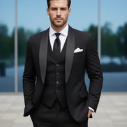 Black suit with white shirt and black tie on a light gray background