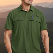 Green short-sleeve shirt worn by a person on a white background