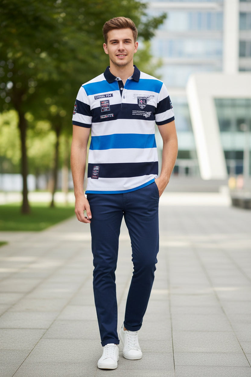 A short-sleeve polo shirt with horizontal stripes in white, blue, and navy, featuring various printed patches and logos on the chest and sleeves. The brand 'TACE&SHARK' is visible as a logo overlay in the top-left corner.