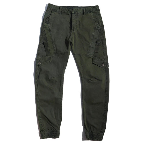 Olive green cargo pants laid flat against a white background, showing angled thigh pockets, buttoned flap pockets, side straps, and gathered ankle cuffs.