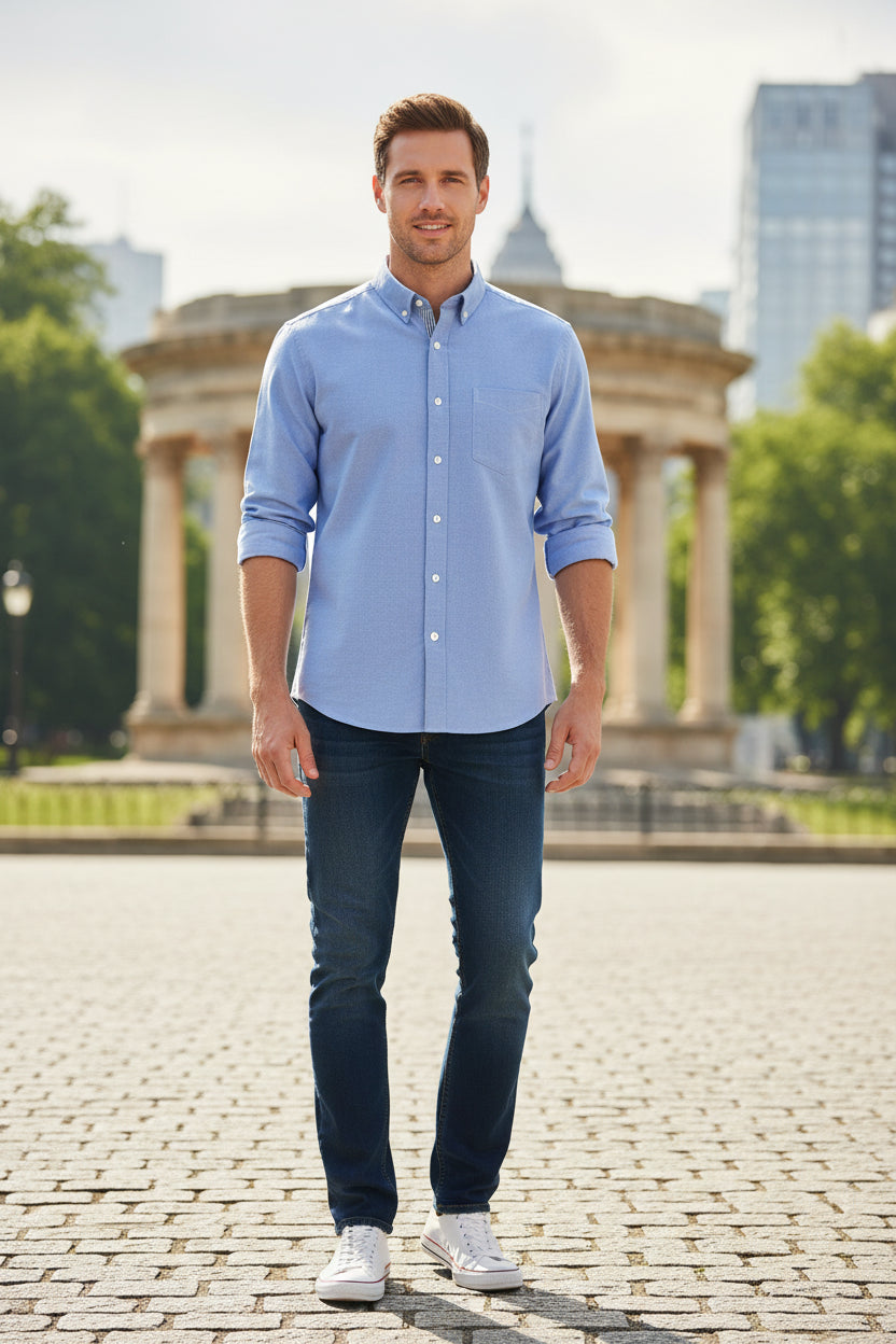 Folded blue shirt on a white background with text indicating color and material.