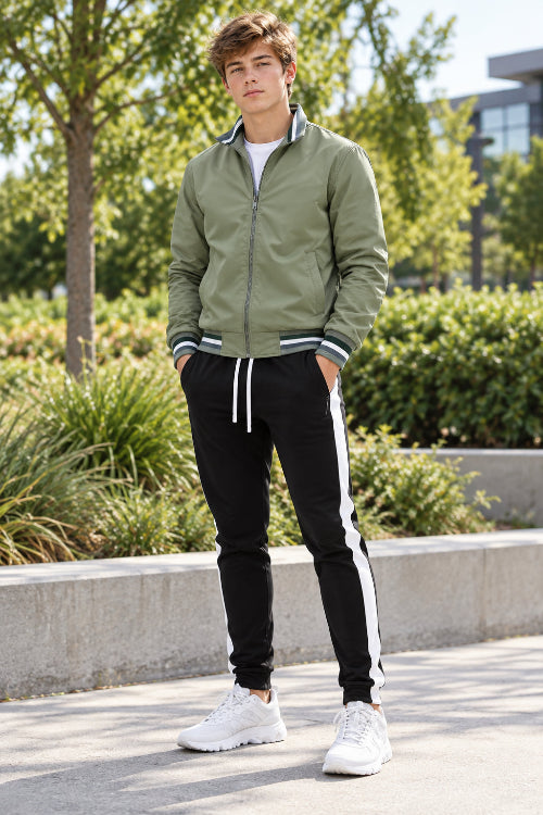 A men's two-piece tracksuit set featuring an olive green zip-up bomber jacket with striped ribbed trim and black track pants 