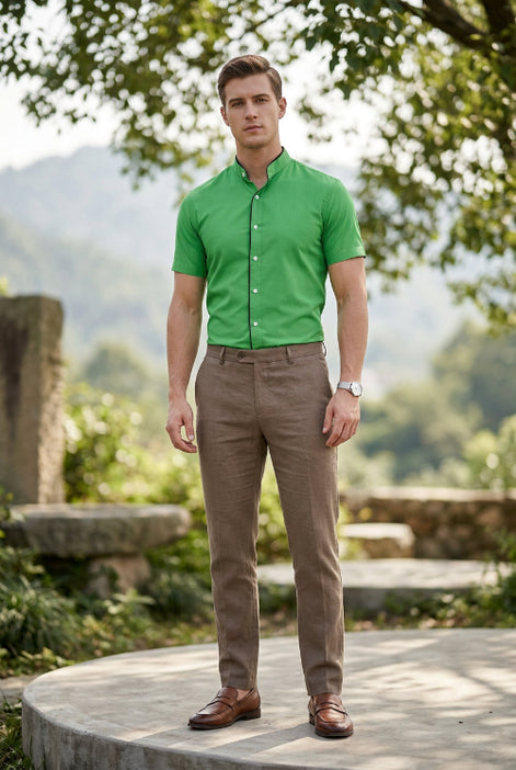 A bright green men's short-sleeve button-up shirt with a mandarin collar, black inner placket, and white buttons, shown on a plain white background.