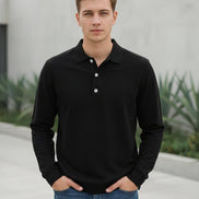 Person wearing a black long-sleeve shirt with a festive background featuring a Christmas tree and red truck.