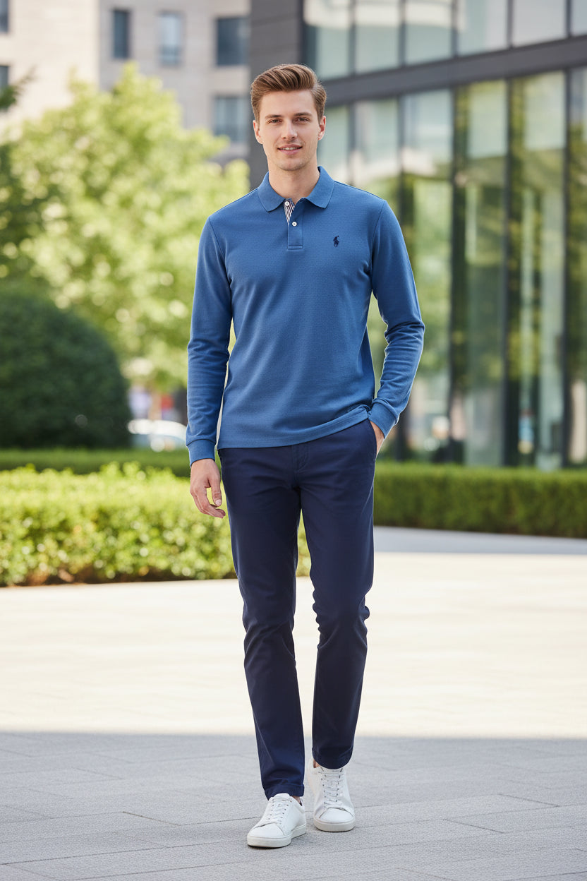 Blue long-sleeve polo shirt on a rack with other colored shirts in the background