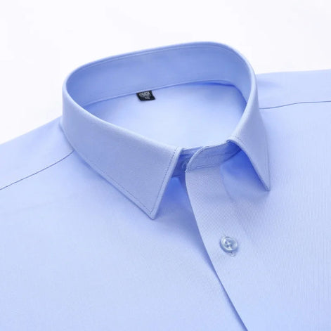 Close-up of a light blue dress shirt with collar and button details on a white background