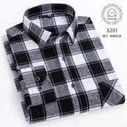 Black and white plaid shirt on a white background with care label.