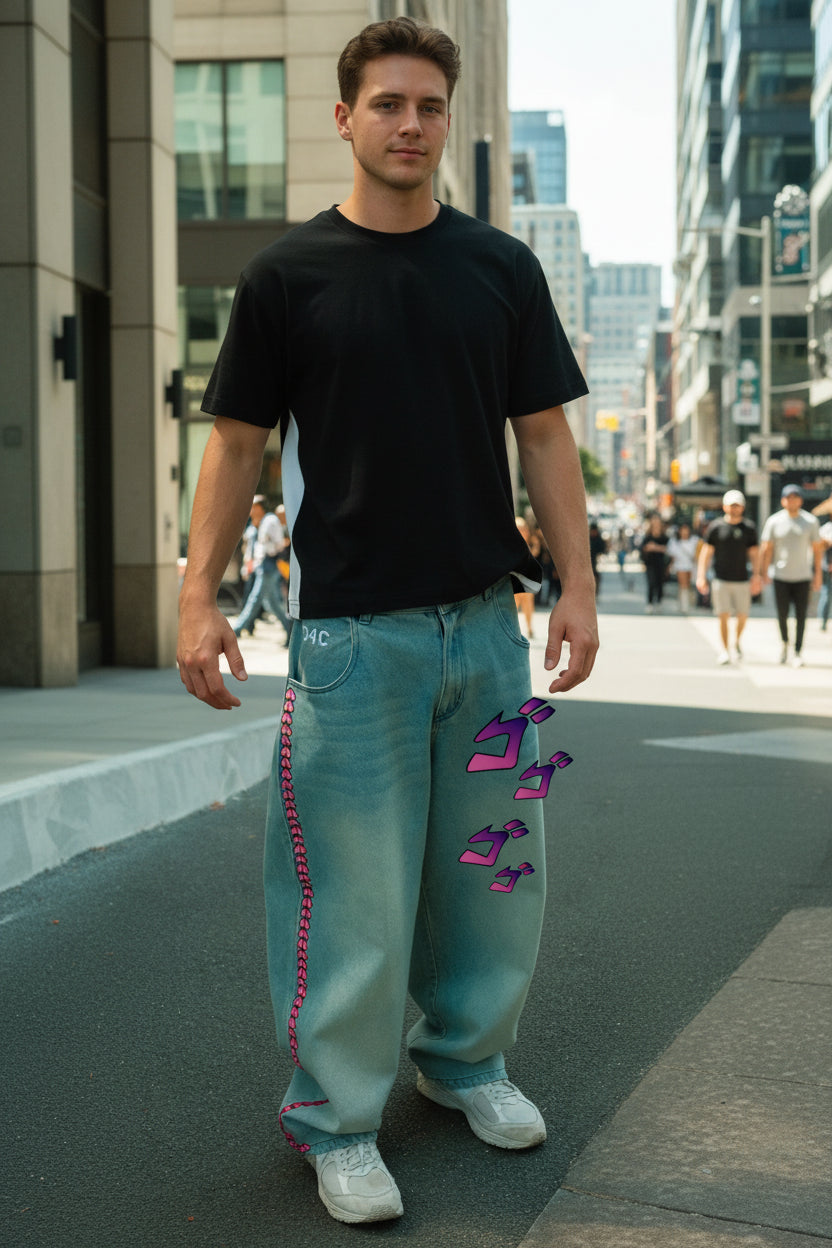 Person wearing blue jeans with pink stitching and purple graphics on a blurred background
