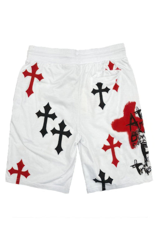 White shorts with black and red cross designs on a white background