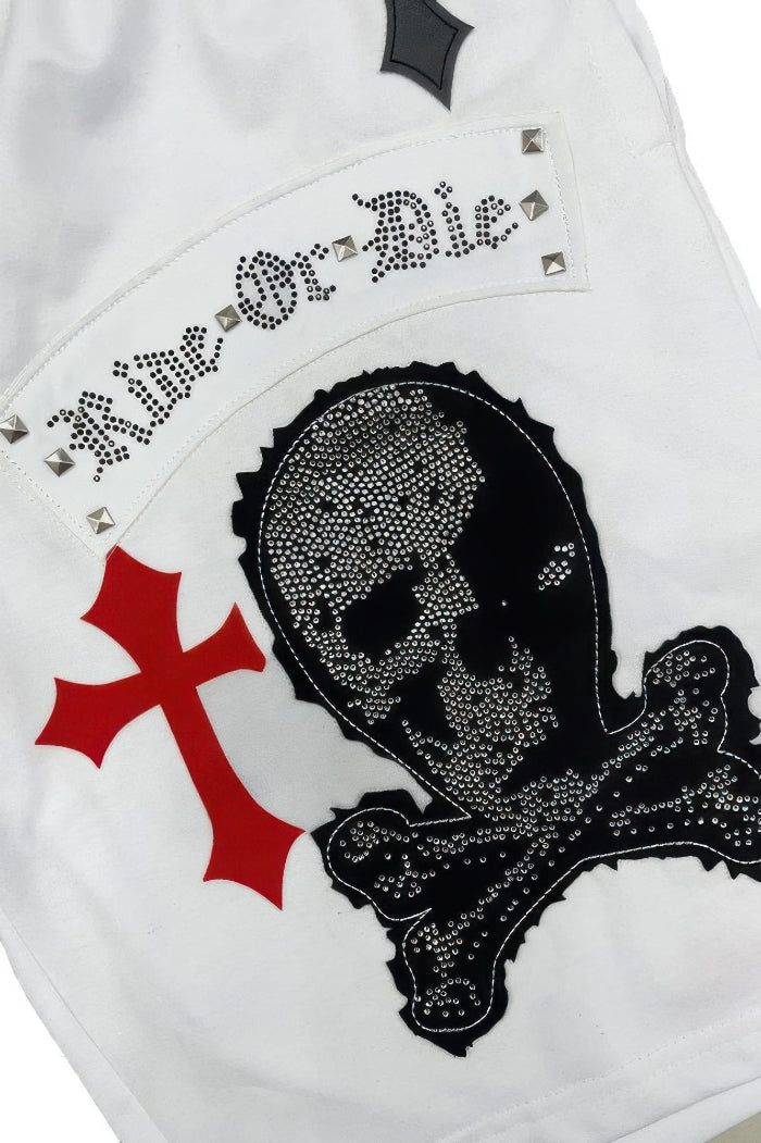 White leather jacket with black skull and crossbones design and 'Live or Die' text.