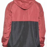 Person wearing a two-tone red and black jacket on a white background