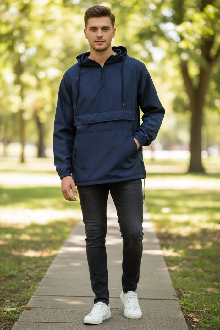 Man wearing a navy blue hooded jacket on a white background