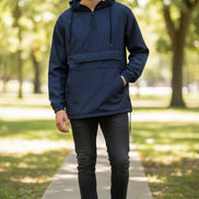 Man wearing a navy blue hooded jacket on a white background