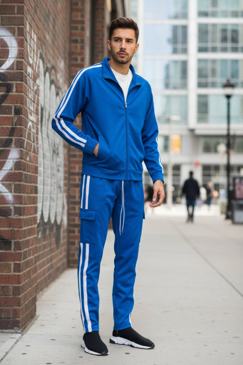 Person wearing a blue tracksuit with white stripes  taken outside
