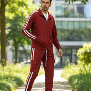 Red tracksuit with white stripes worn by a person  taken outside