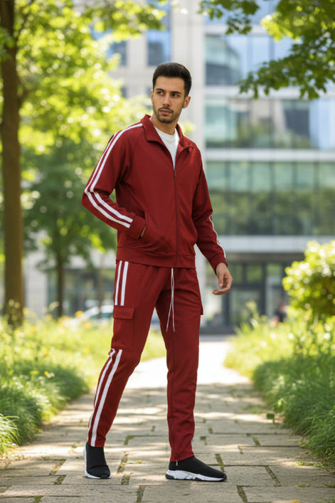 Red tracksuit with white stripes worn by a person  taken outside