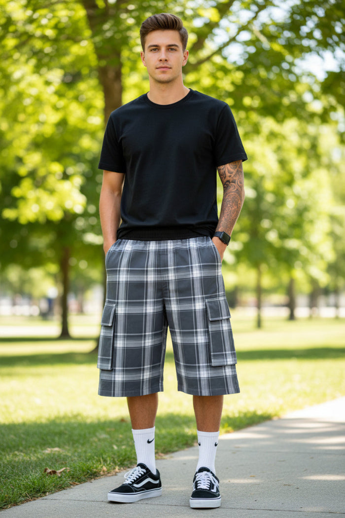 Person wearing plaid shorts with pockets on a white background