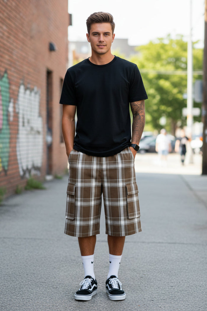 Person wearing brown plaid cargo shorts on a white background